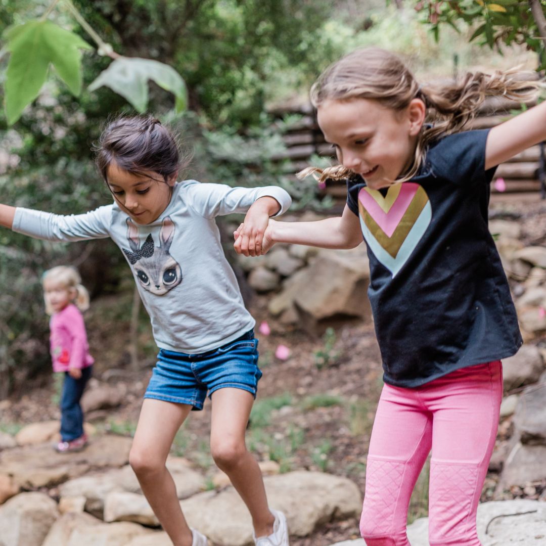 Jumping girls in nature