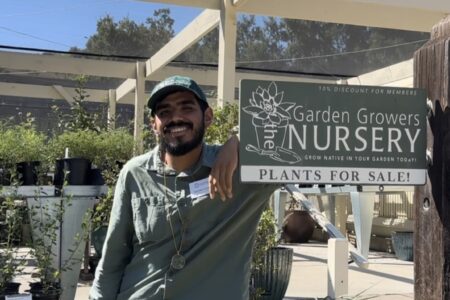 Alejandro standing in front of Santa Barbara Botanic Garden's Nursery
