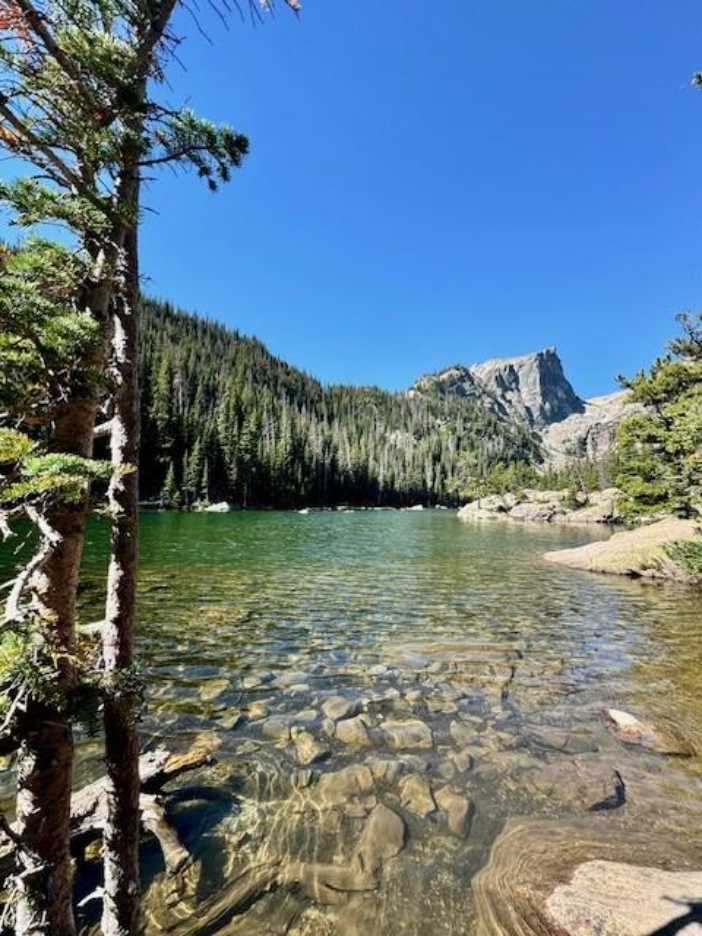 view of lake surrounded by mountains